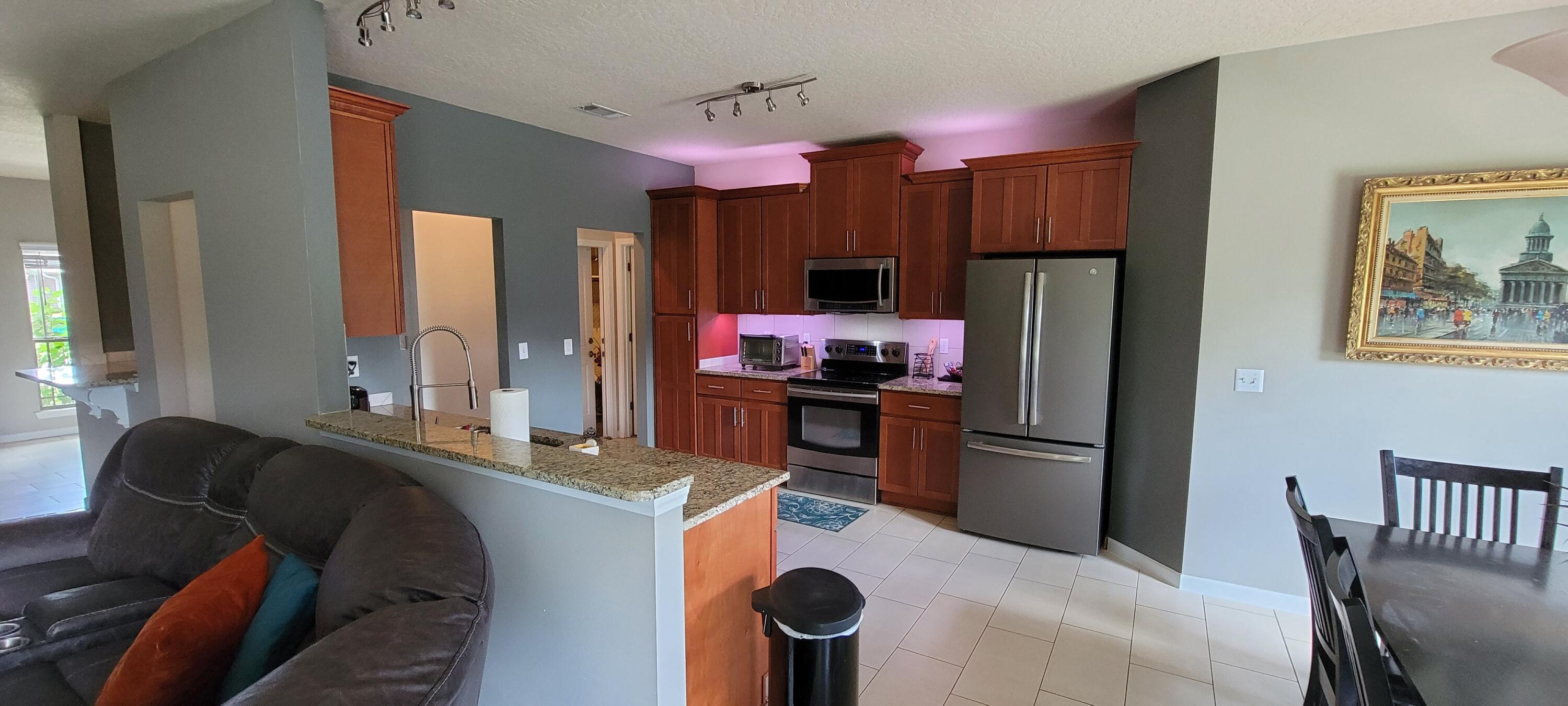 4598 Hermosa Road Crestview, FL 32539 - Photo 8 of 31 a kitchen with a refrigerator and a stove