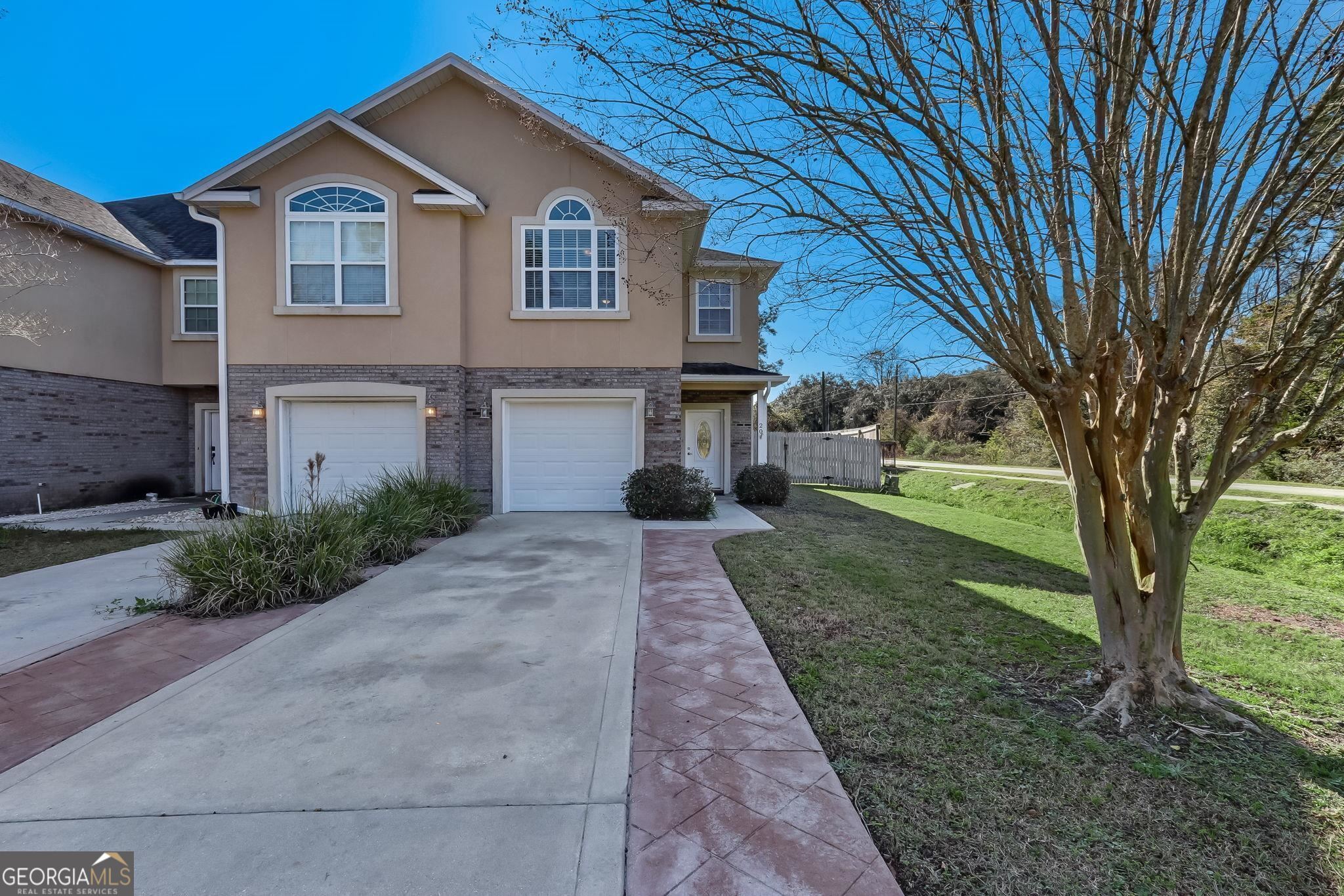 20 Lonesome Pine Road St. Marys, GA 31558 - Photo 1 of 1 a front view of a house with a yard