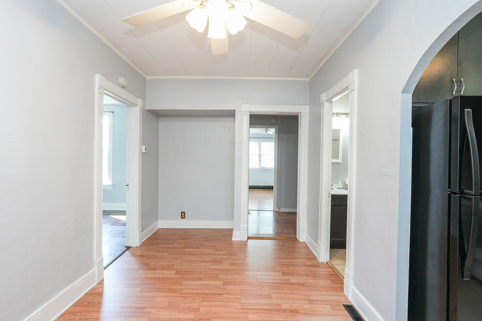 264 West 3rd Street Manteno, IL 60950 - Photo 11 of 29 a view of a hallway with wooden floor and a bathroom