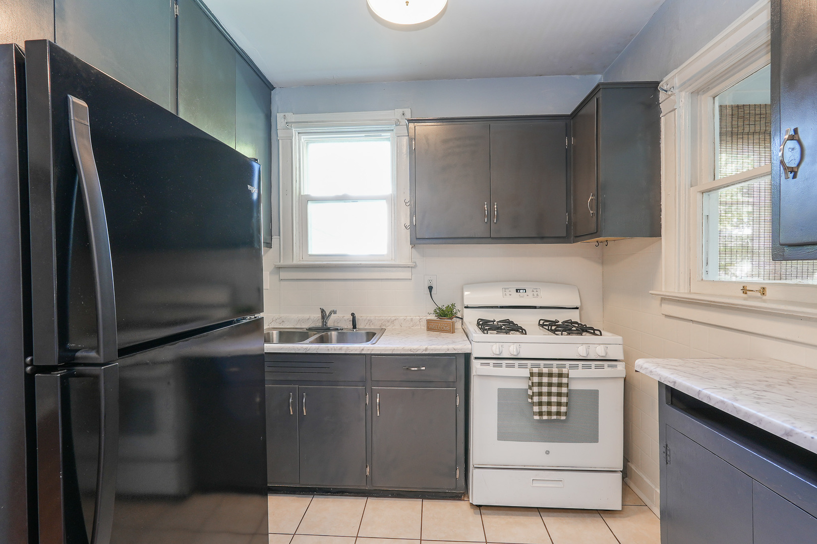 264 West 3rd Street Manteno, IL 60950 - Photo 15 of 29 a kitchen with a sink stove and refrigerator