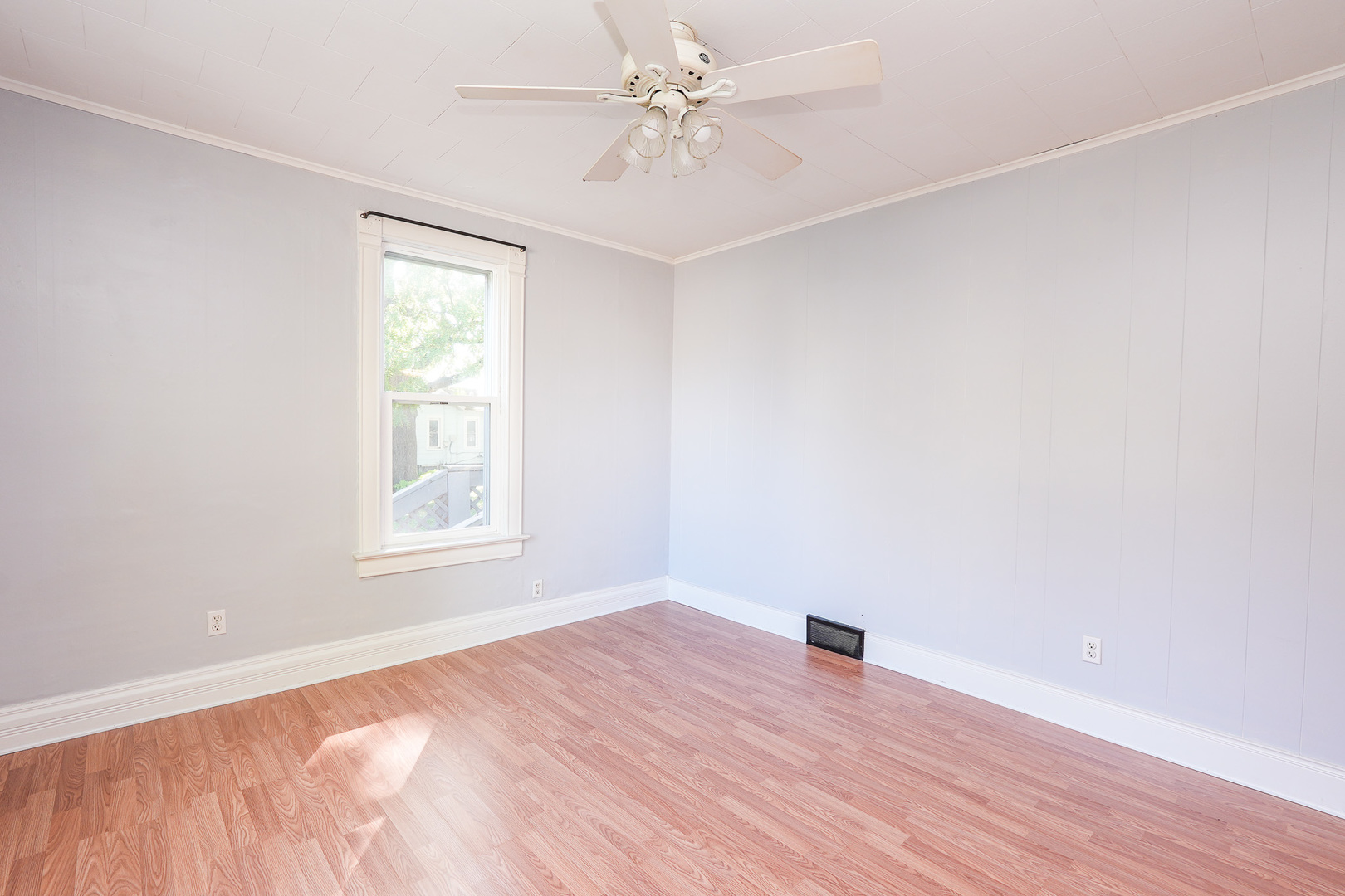 264 West 3rd Street Manteno, IL 60950 - Photo 19 of 29 an empty room with a window and a ceiling fan