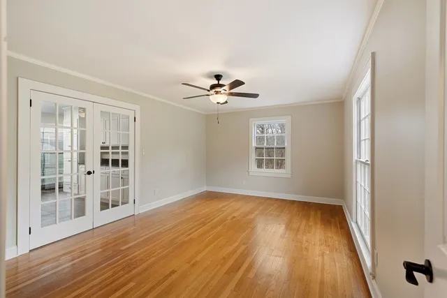 a kitchen with a stove top oven a sink a dining table and chairs