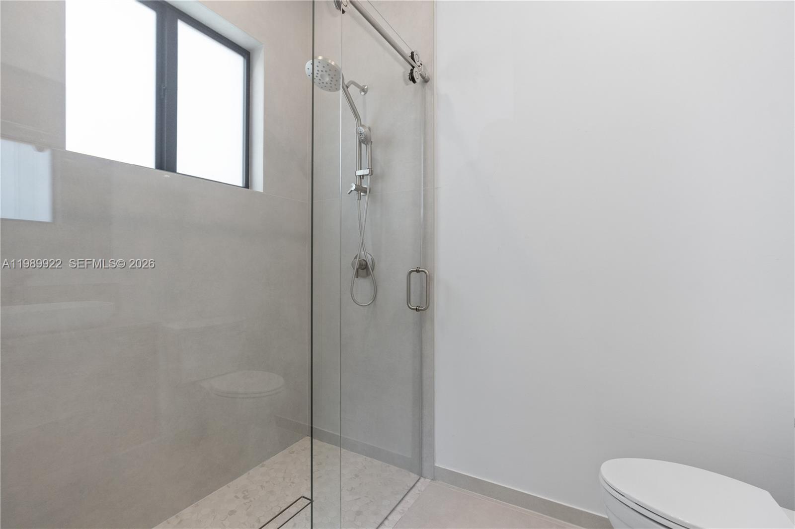 6221 Southwest 60th Street South Miami, FL 33143 - Photo 24 of 42 a bathroom with a shower and toilet