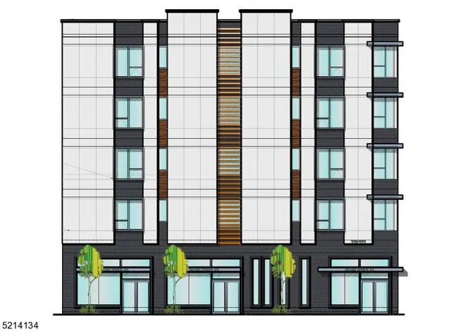 a view of a brick building next to a yard