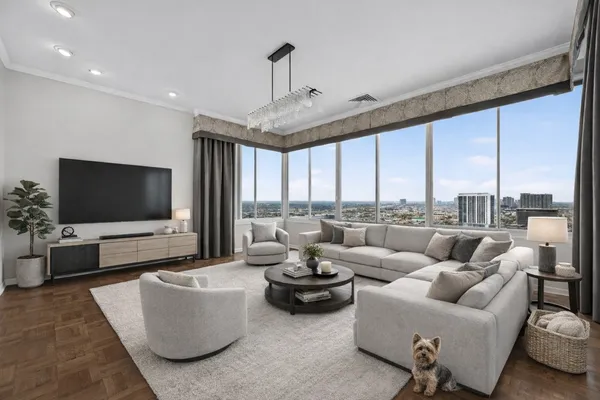 a living room with furniture and a flat screen tv
