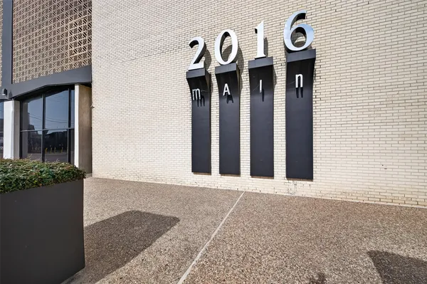 a view of empty room with floor to ceiling window and air hockey table