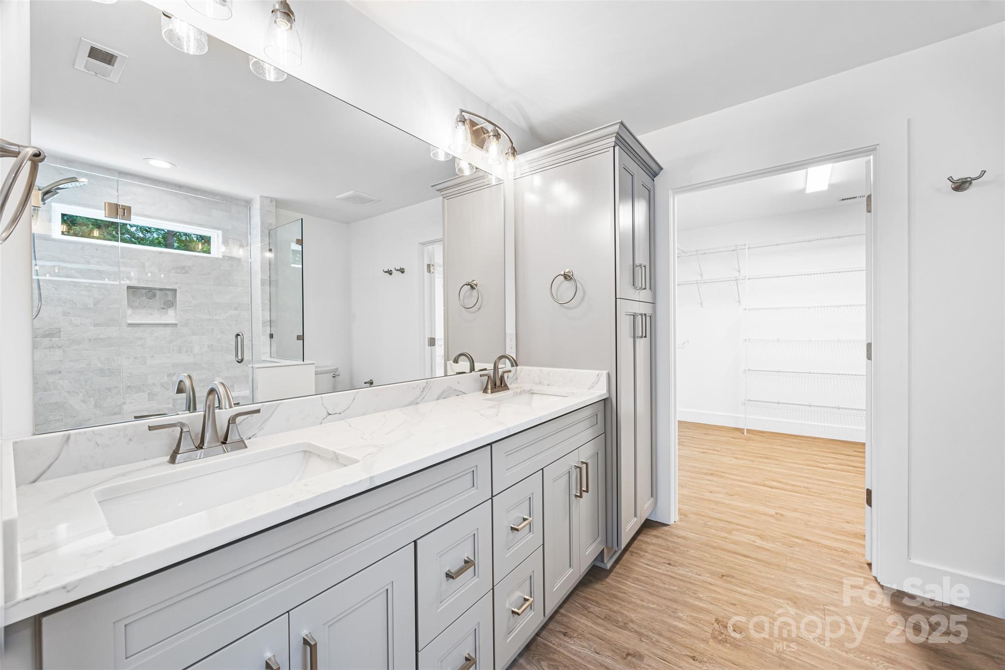 2027 Marquesas Avenue Tega Cay, SC 29708 - Photo 17 of 46 a bathroom with a double vanity sink mirror and