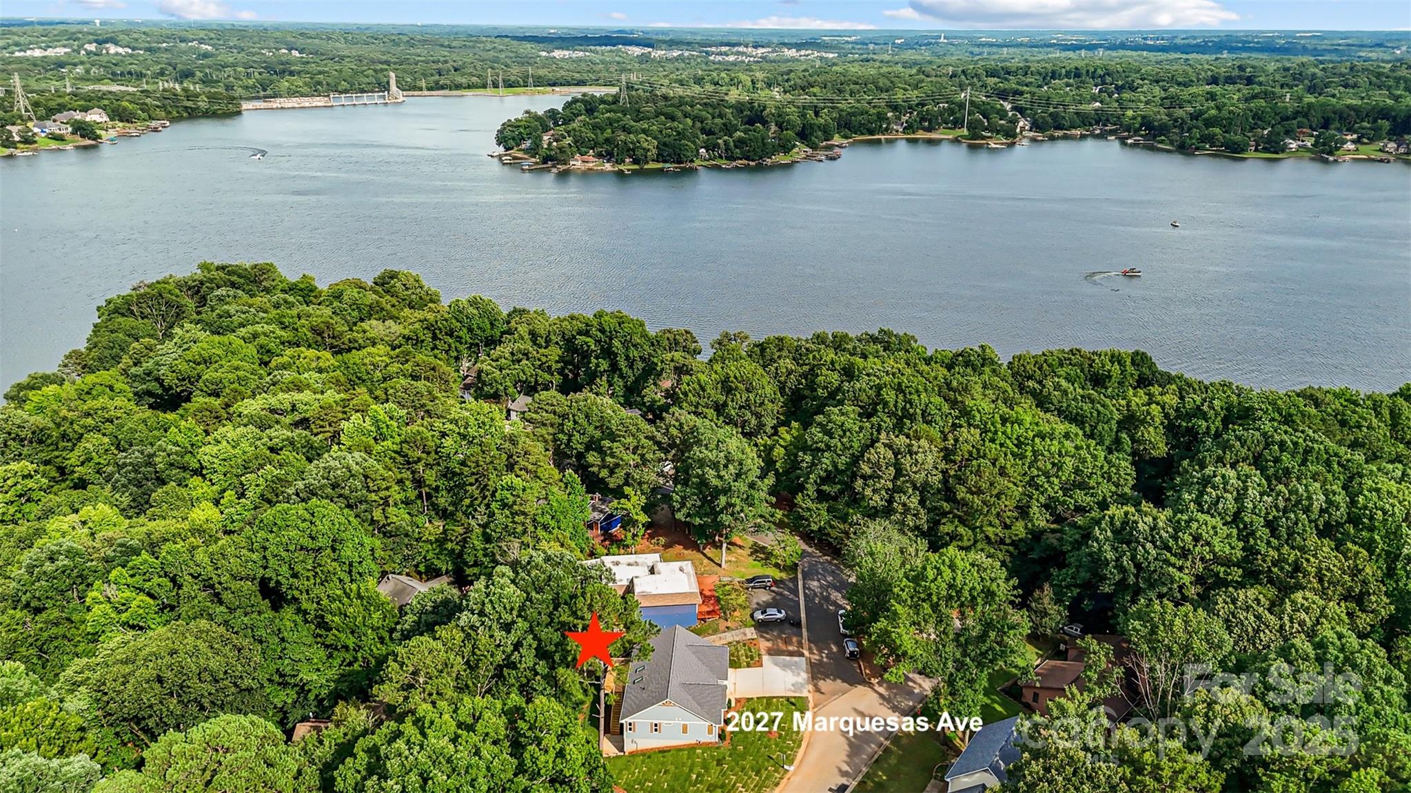 2027 Marquesas Avenue Tega Cay, SC 29708 - Photo 2 of 46 an aerial view of a houses with ocean view