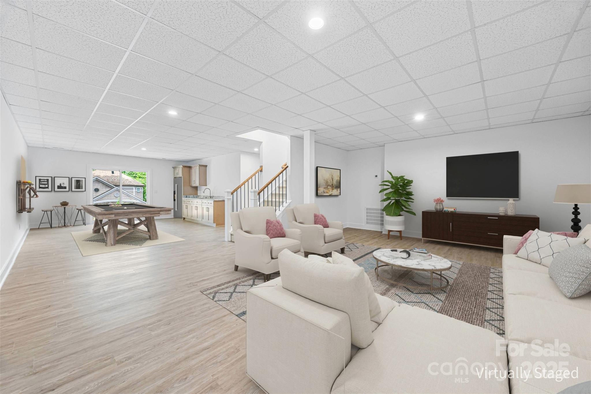 2027 Marquesas Avenue Tega Cay, SC 29708 - Photo 26 of 46 a living room with furniture and a flat screen tv