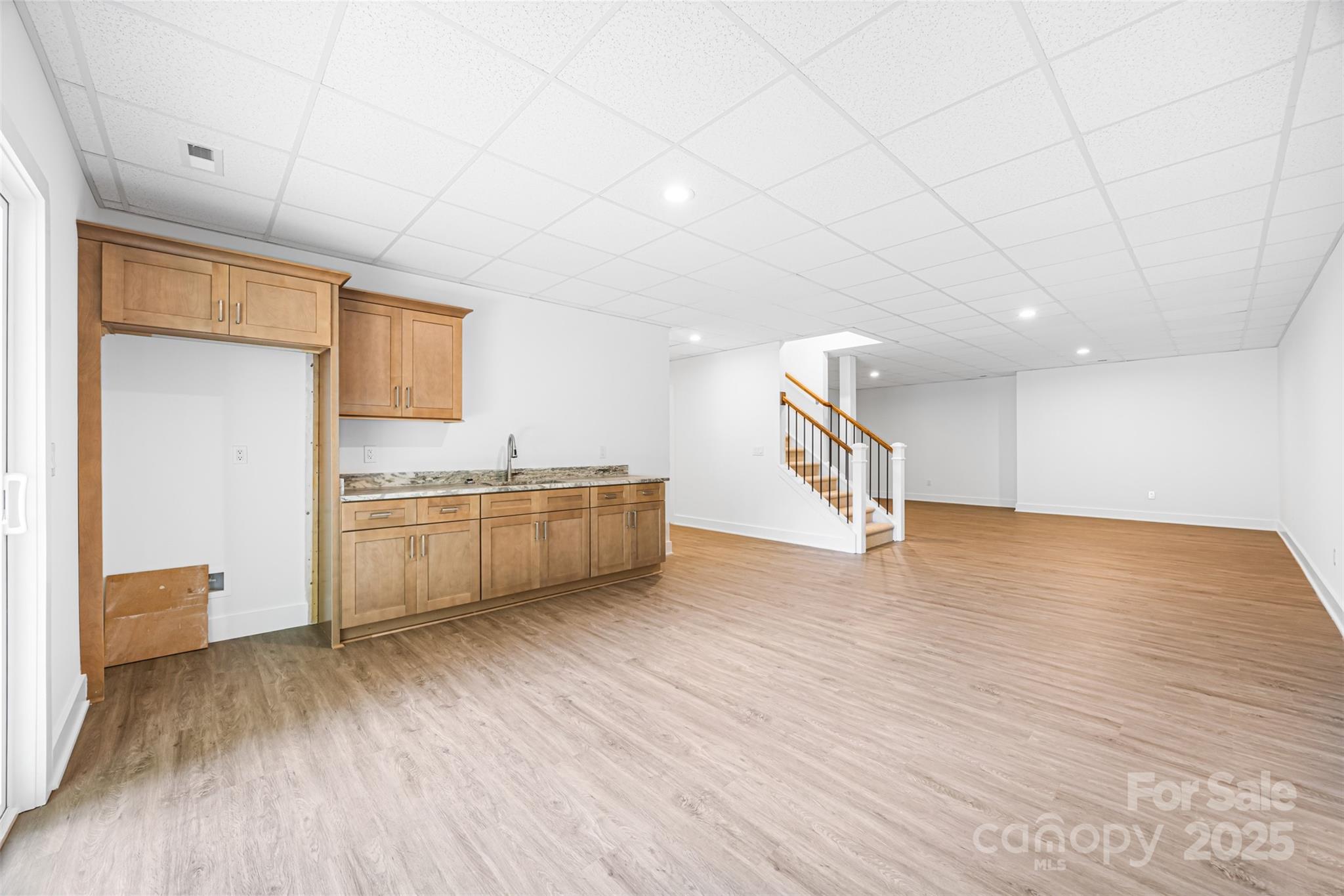 2027 Marquesas Avenue Tega Cay, SC 29708 - Photo 28 of 46 a view of a kitchen with a sink and a refrigerator