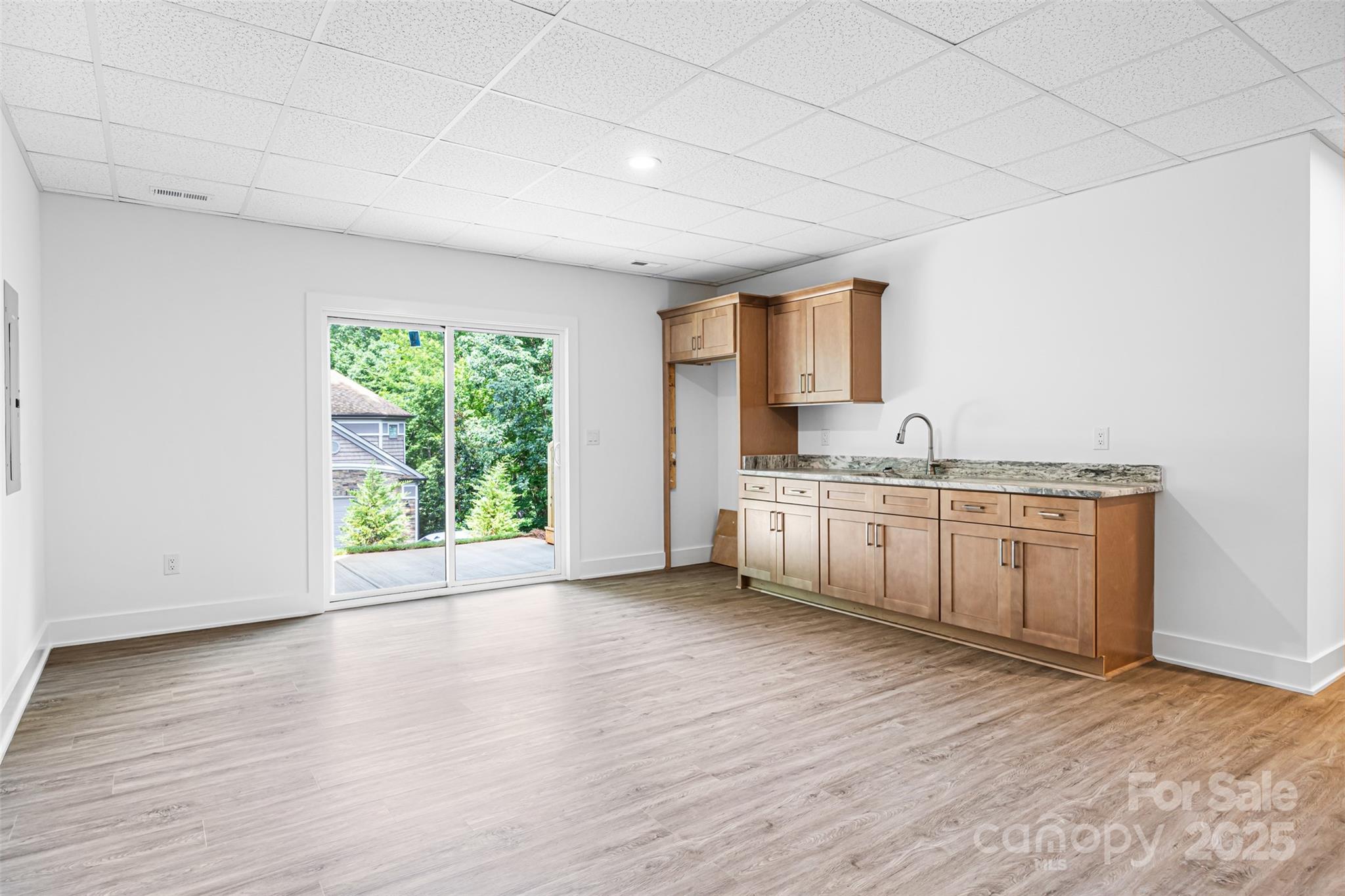 2027 Marquesas Avenue Tega Cay, SC 29708 - Photo 29 of 46 a view of a kitchen with wooden floor and electronic appliances
