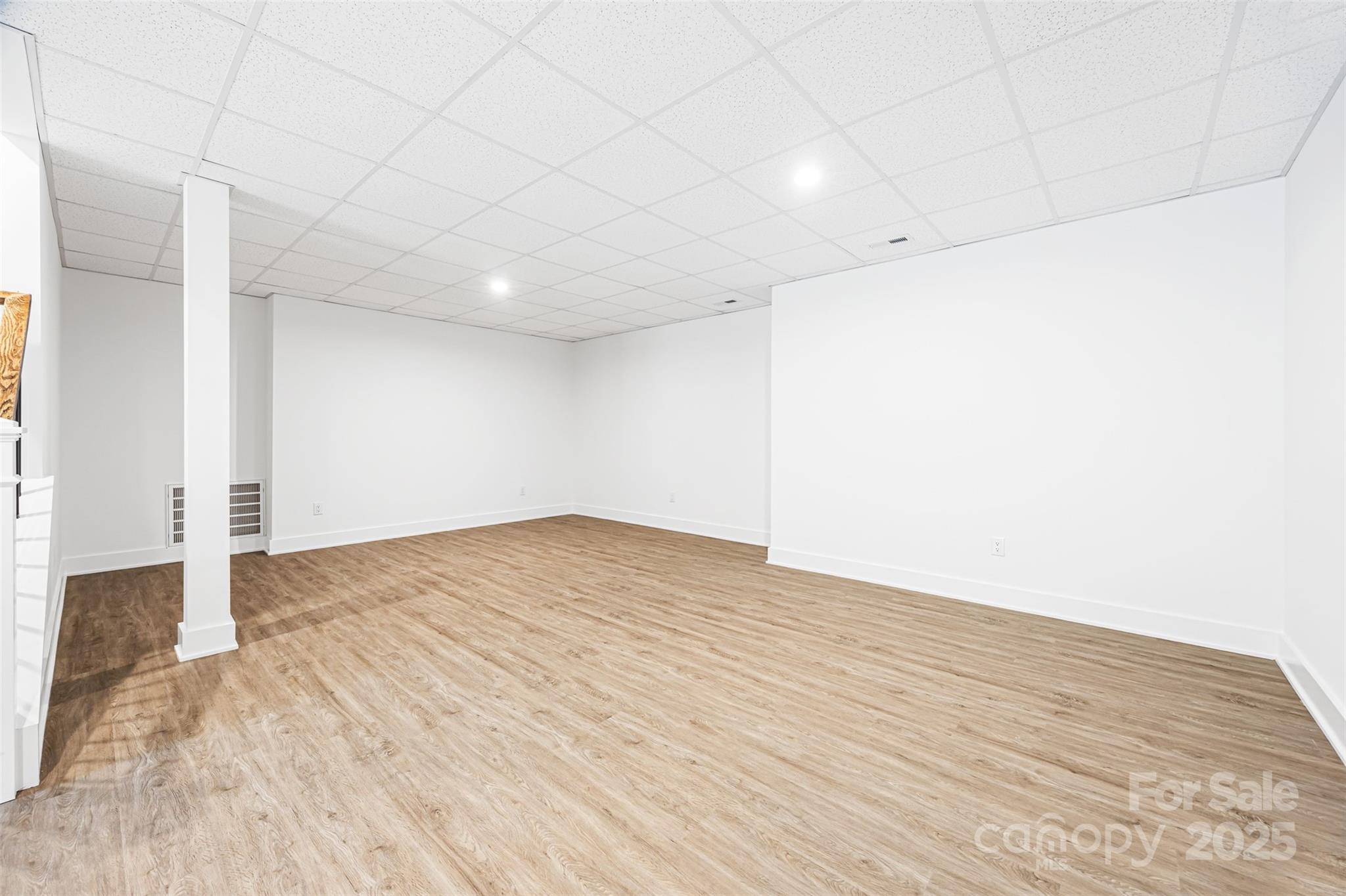 2027 Marquesas Avenue Tega Cay, SC 29708 - Photo 32 of 46 a view of empty room with wooden floor