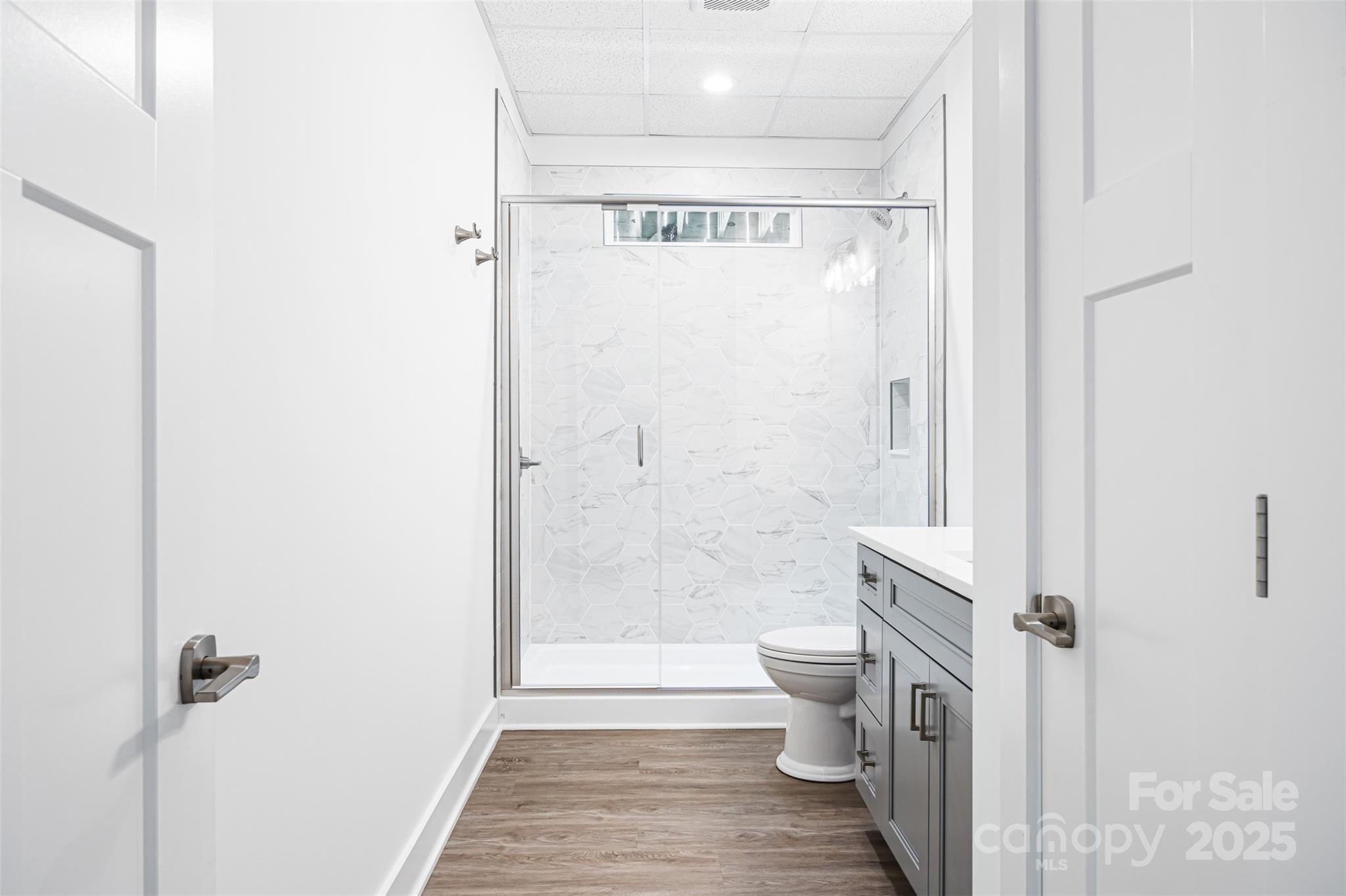 2027 Marquesas Avenue Tega Cay, SC 29708 - Photo 36 of 46 a bathroom with a shower and a toilet