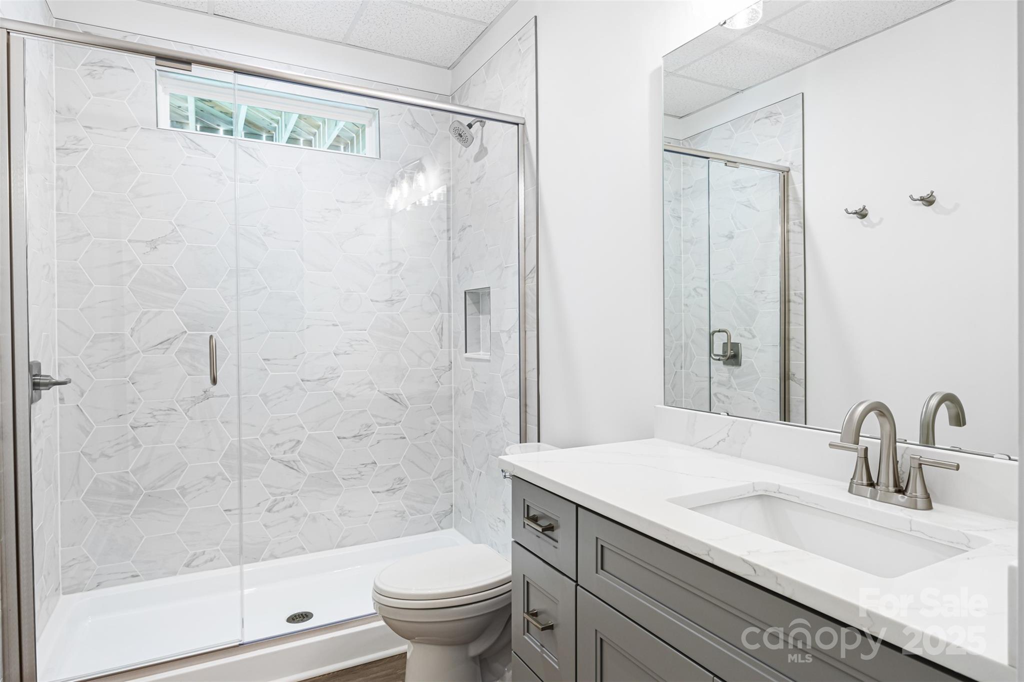 2027 Marquesas Avenue Tega Cay, SC 29708 - Photo 37 of 46 a bathroom with a sink and a mirror