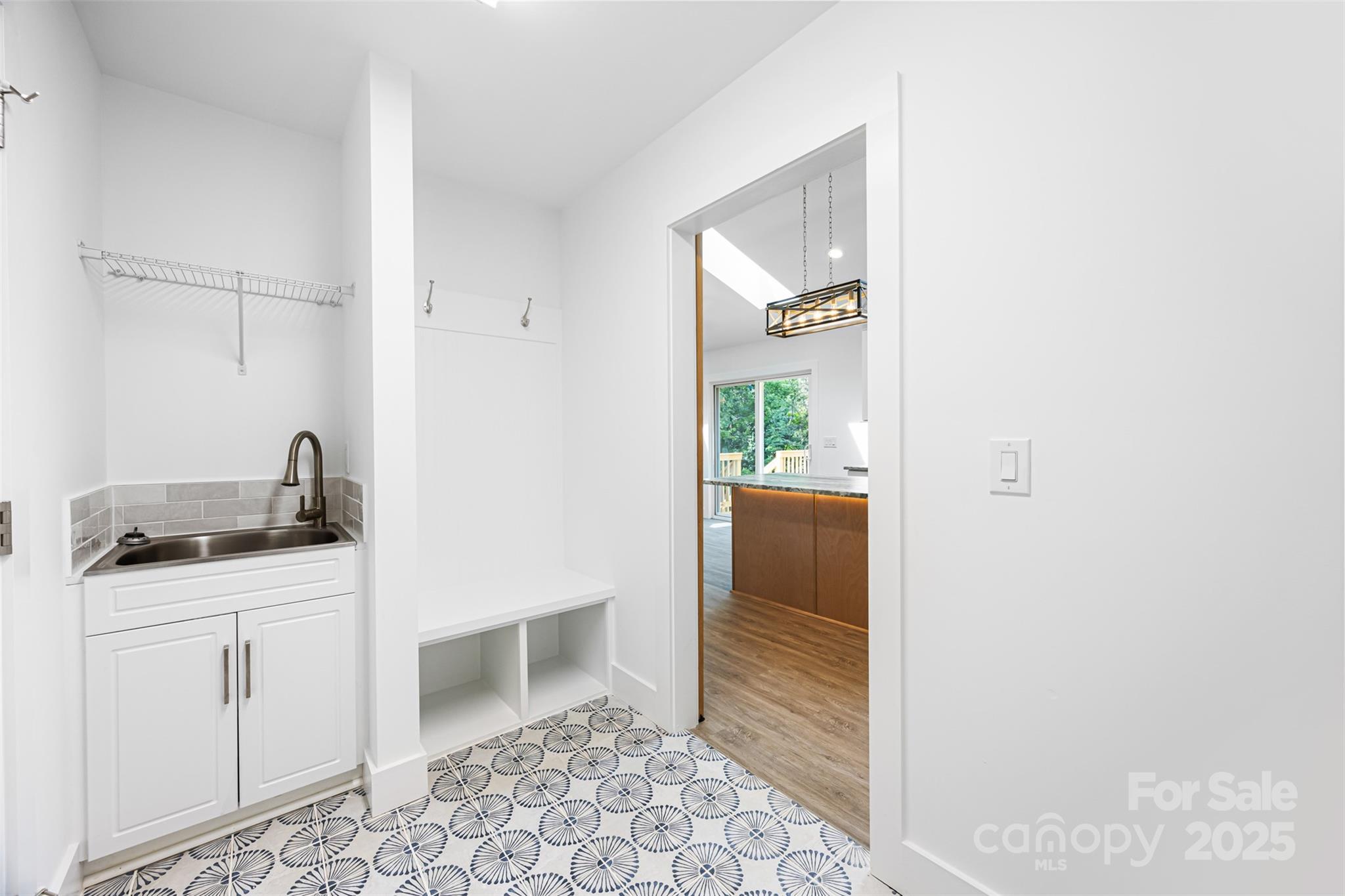 2027 Marquesas Avenue Tega Cay, SC 29708 - Photo 38 of 46 a kitchen with granite countertop a sink and a stove top oven