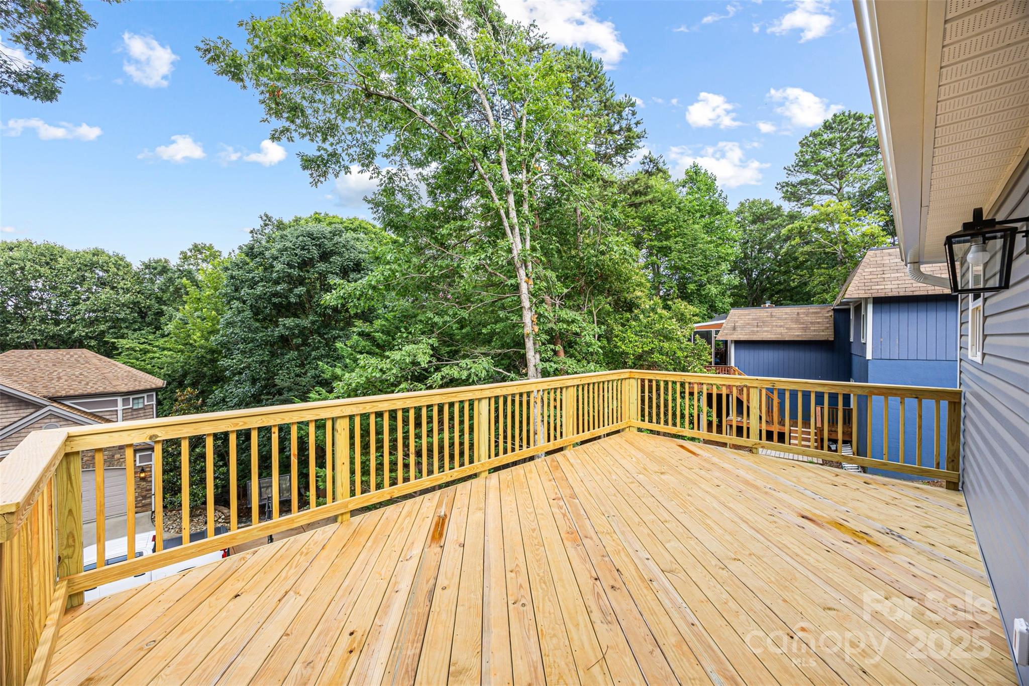 2027 Marquesas Avenue Tega Cay, SC 29708 - Photo 40 of 46 a view of balcony with wooden floor and fence