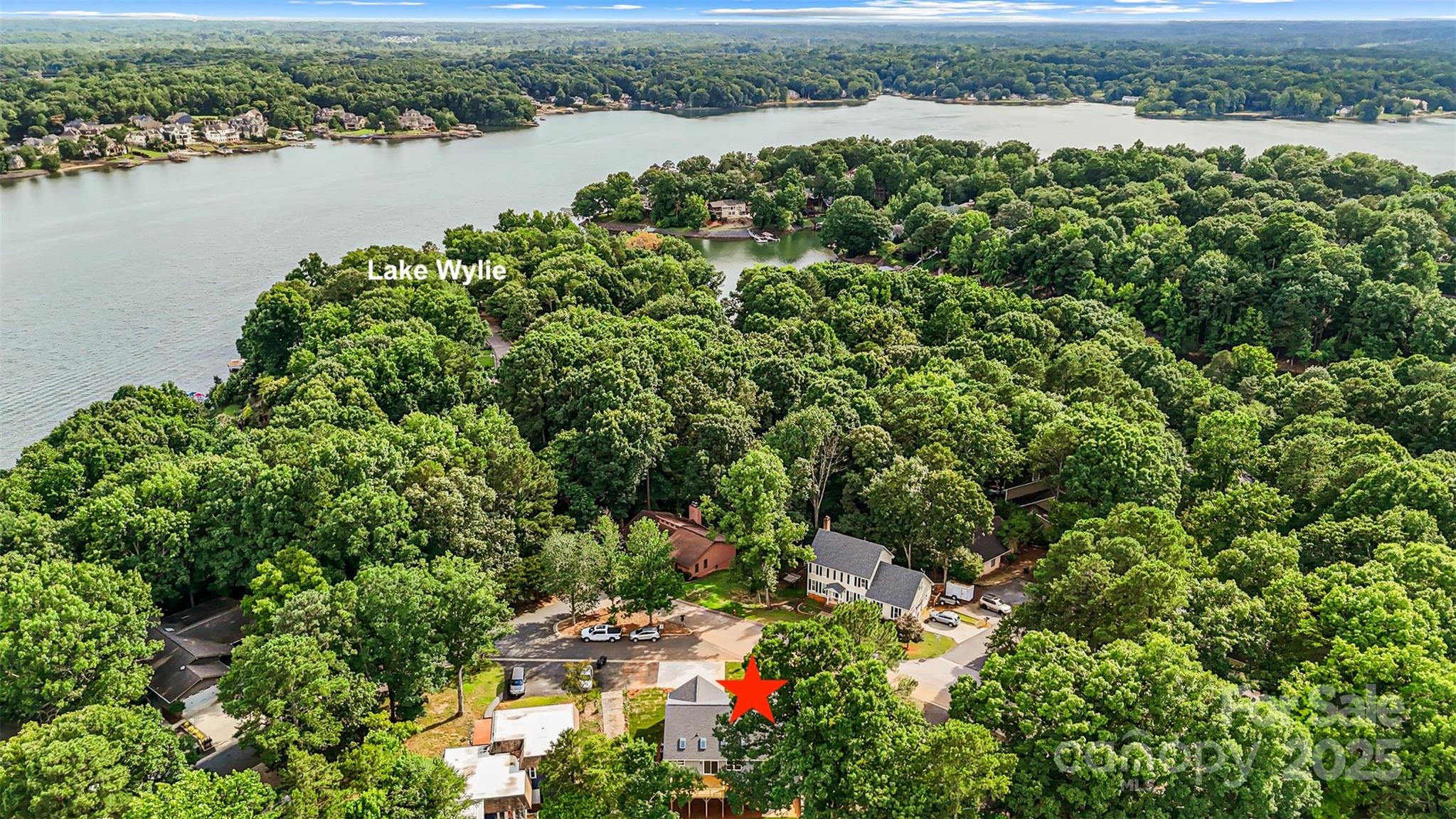 2027 Marquesas Avenue Tega Cay, SC 29708 - Photo 46 of 46 an aerial view of a houses with a lake view