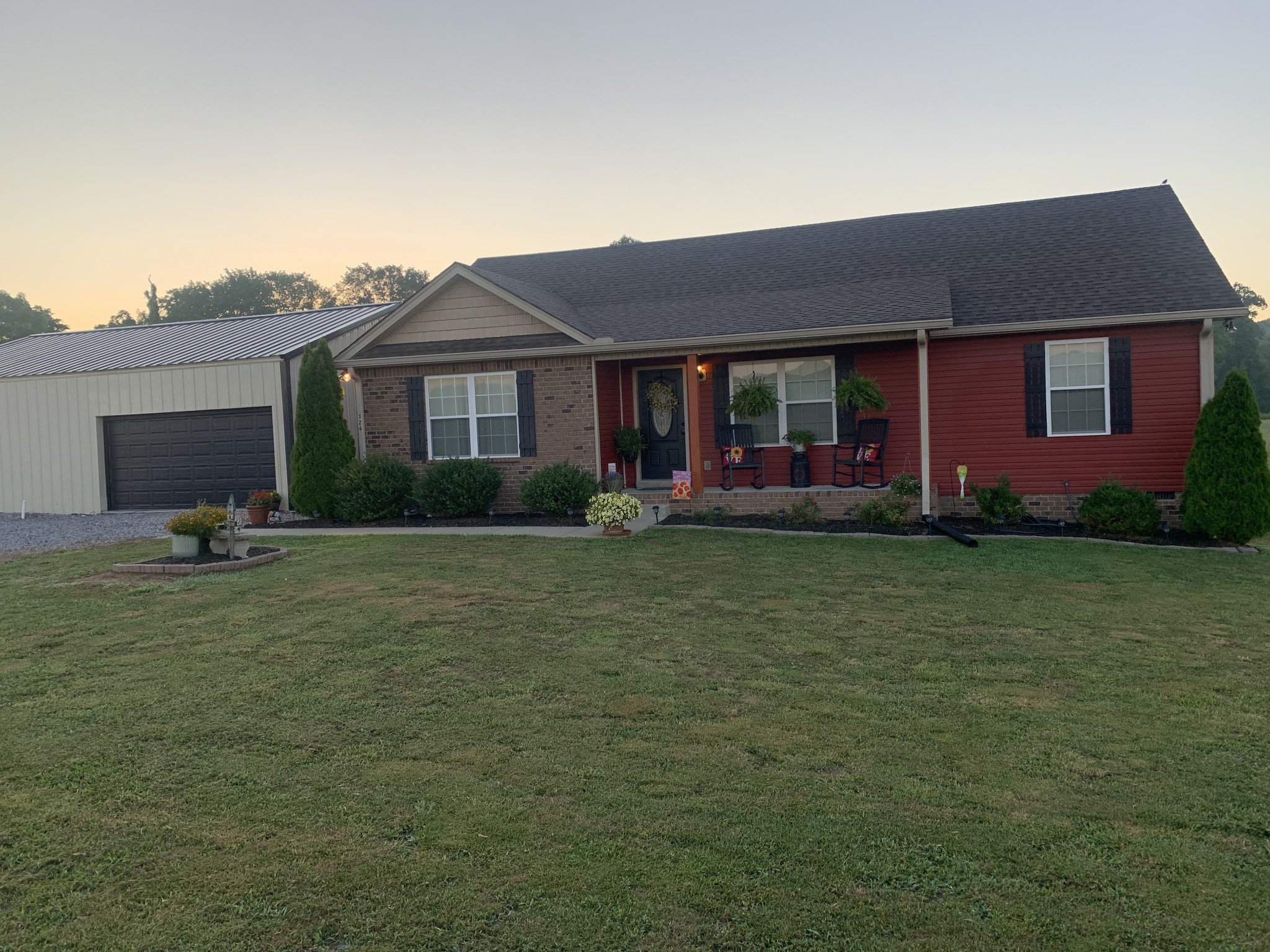 326 Meadows Road Portland, TN 37148 - Photo 1 of 39 a front view of a house with garden