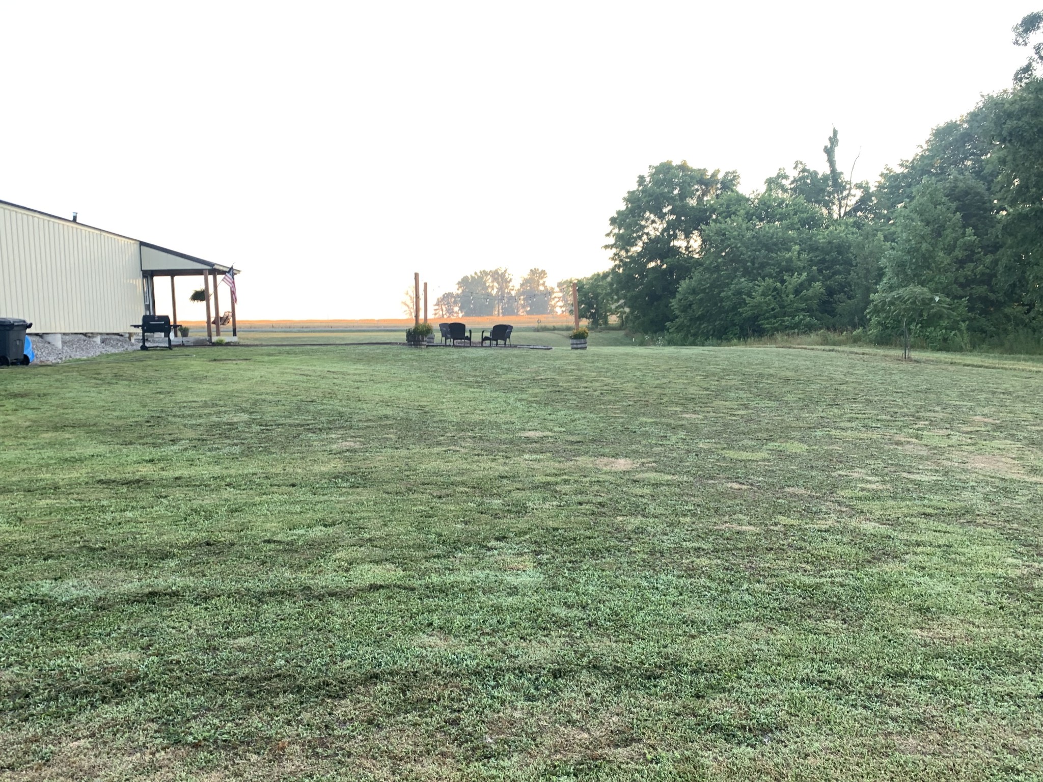 326 Meadows Road Portland, TN 37148 - Photo 11 of 39 a view of a field with an trees in front of it