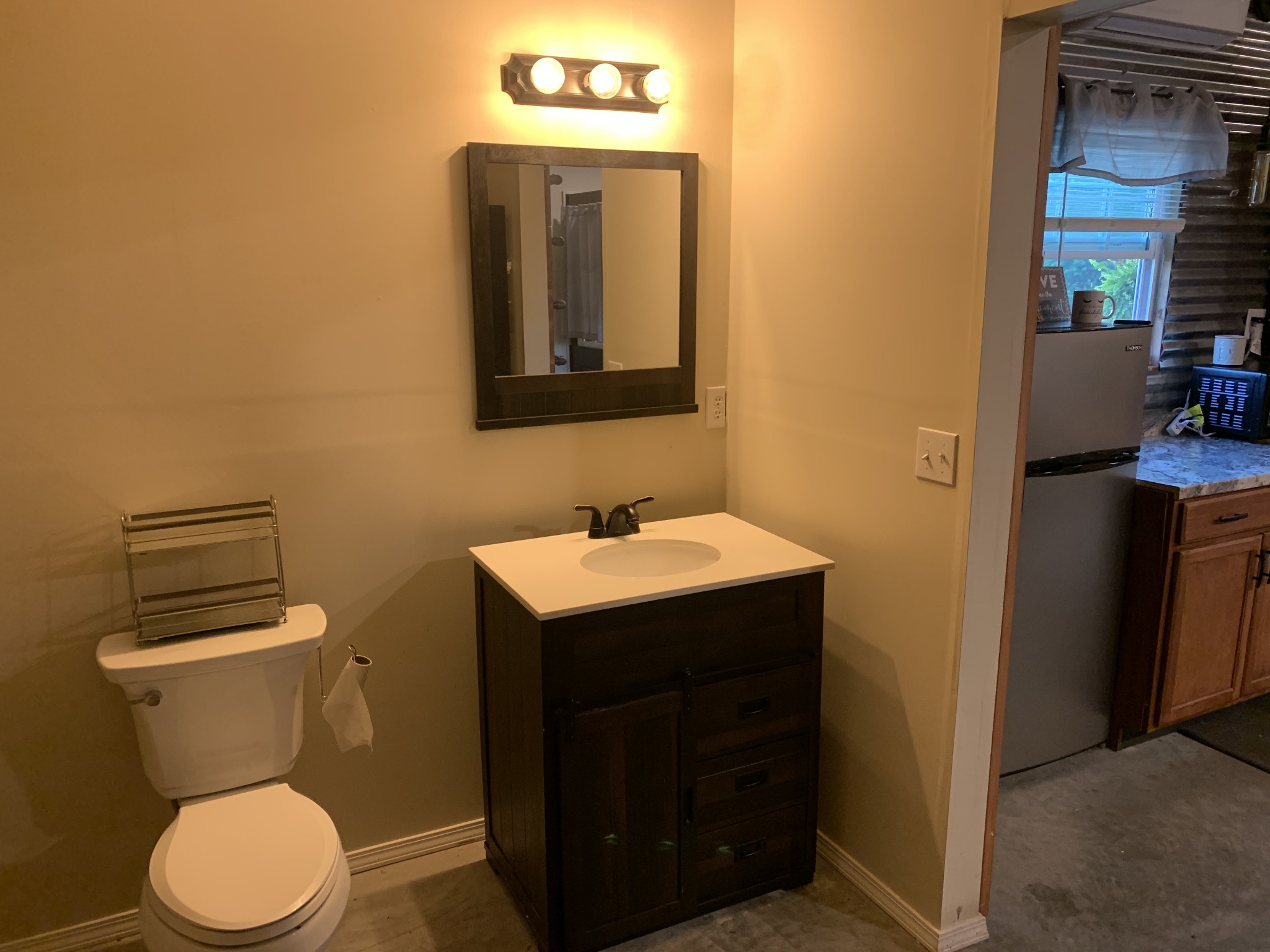 326 Meadows Road Portland, TN 37148 - Photo 13 of 39 a bathroom with a toilet a sink and mirror