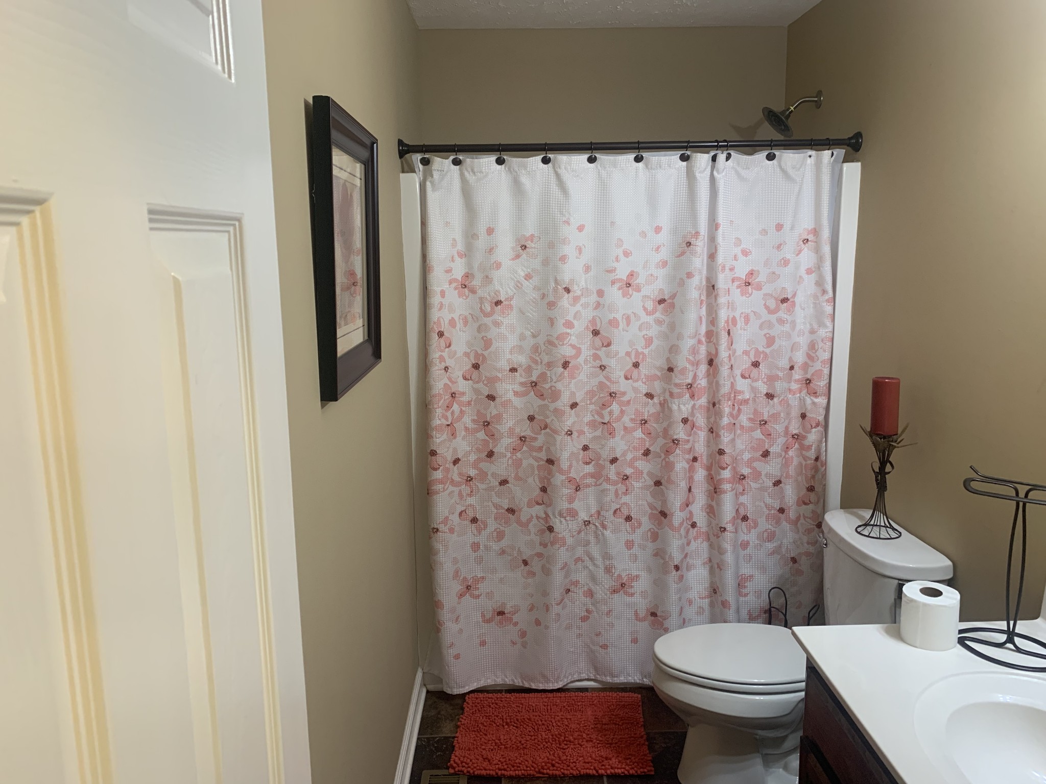 326 Meadows Road Portland, TN 37148 - Photo 27 of 39 a white toilet sitting next to a shower curtain