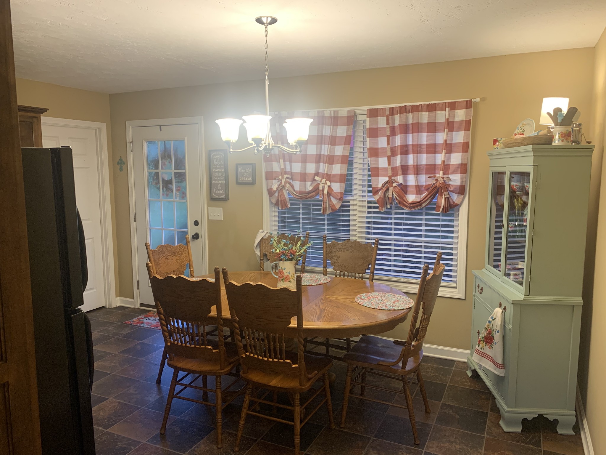326 Meadows Road Portland, TN 37148 - Photo 32 of 39 a view of a dining room with furniture and chandelier