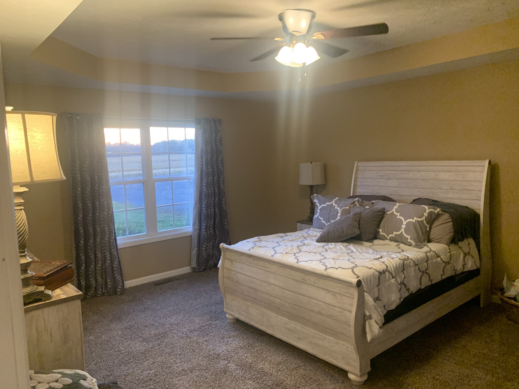 326 Meadows Road Portland, TN 37148 - Photo 35 of 39 a bedroom with a bed and a chandelier