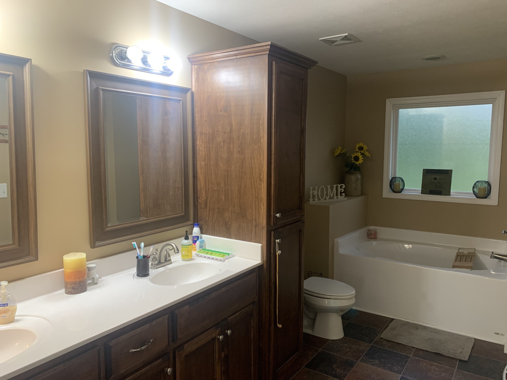 326 Meadows Road Portland, TN 37148 - Photo 37 of 39 a bathroom with a granite countertop sink toilet a large mirror a bathtub and shower