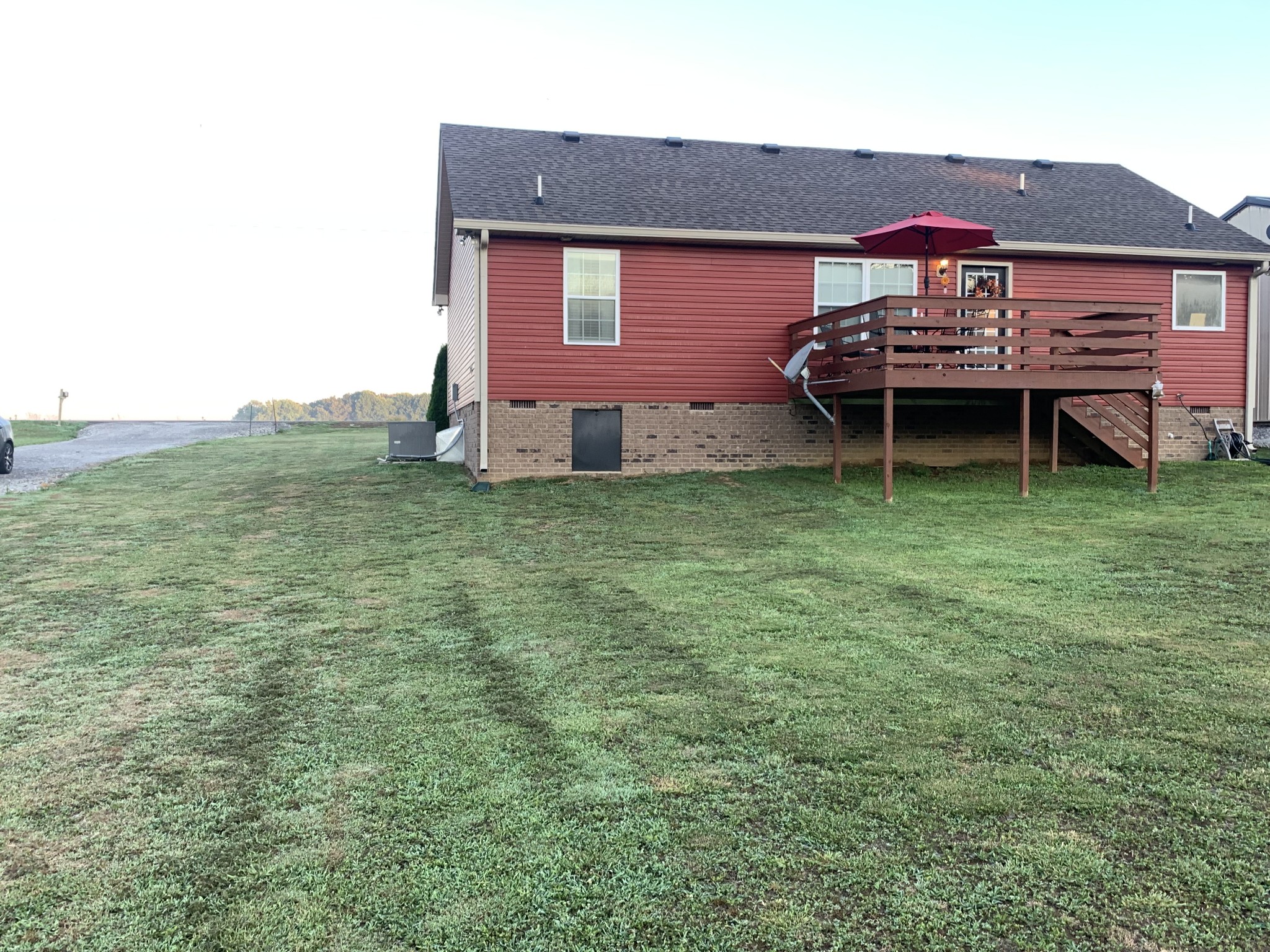 326 Meadows Road Portland, TN 37148 - Photo 10 of 39 a backyard of a house with table and chairs