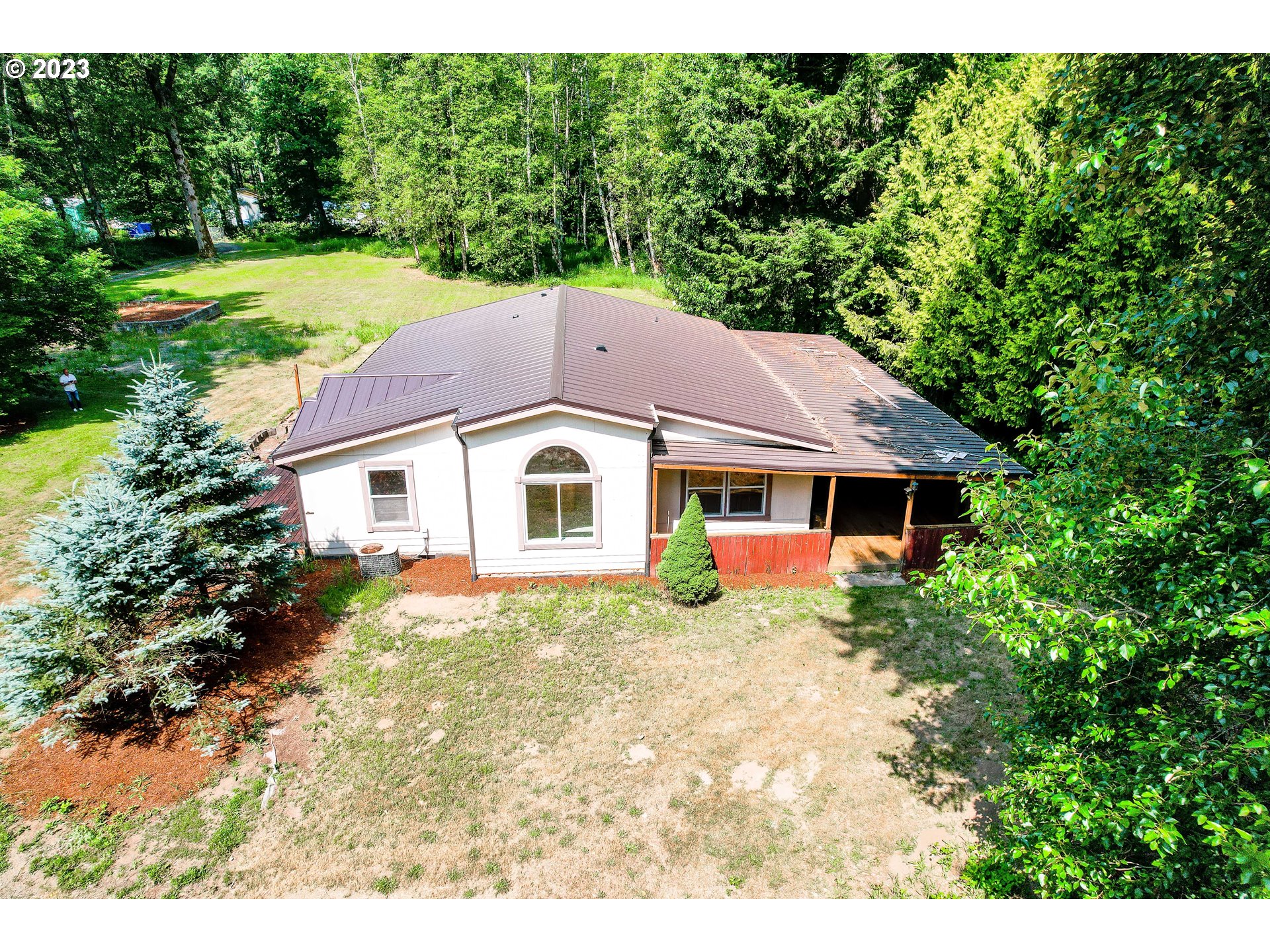 a house with a yard in front of it