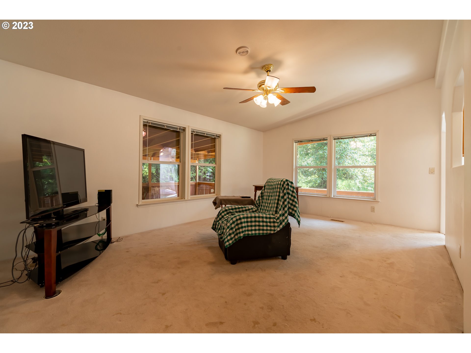 60929 Highway 26 Sandy, OR 97055 - Photo 12 of 38 a living room with furniture and a flat screen tv