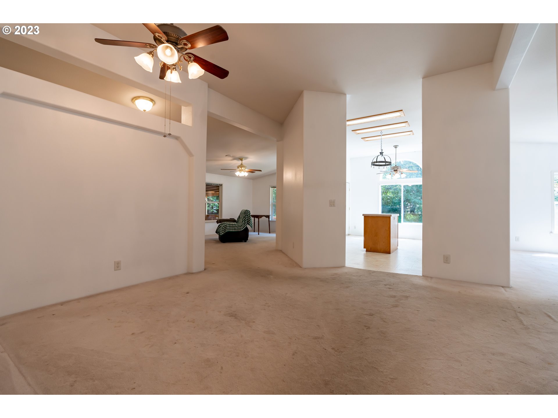 60929 Highway 26 Sandy, OR 97055 - Photo 14 of 38 a view of a livingroom with a ceiling fan and a chandelier fan