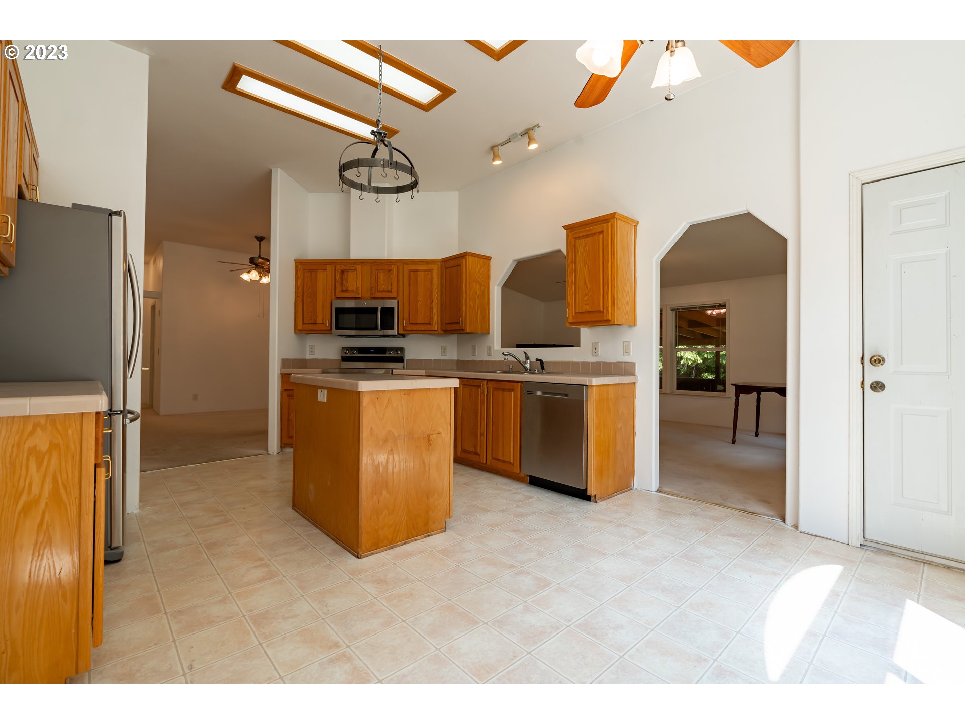 60929 Highway 26 Sandy, OR 97055 - Photo 18 of 38 a kitchen that has a lot of cabinets and stainless steel appliances
