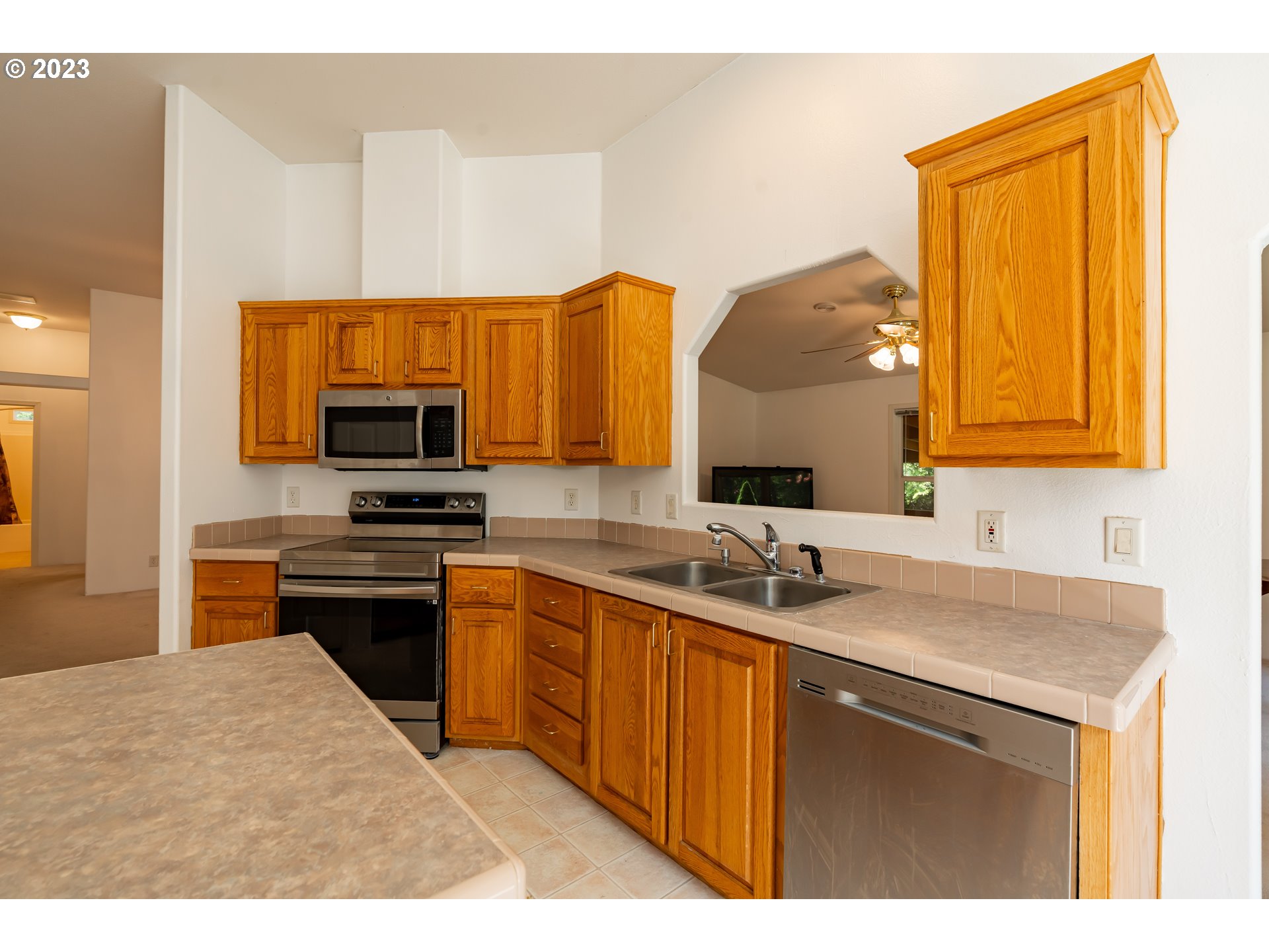 60929 Highway 26 Sandy, OR 97055 - Photo 20 of 38 a kitchen with a sink a stove and cabinets