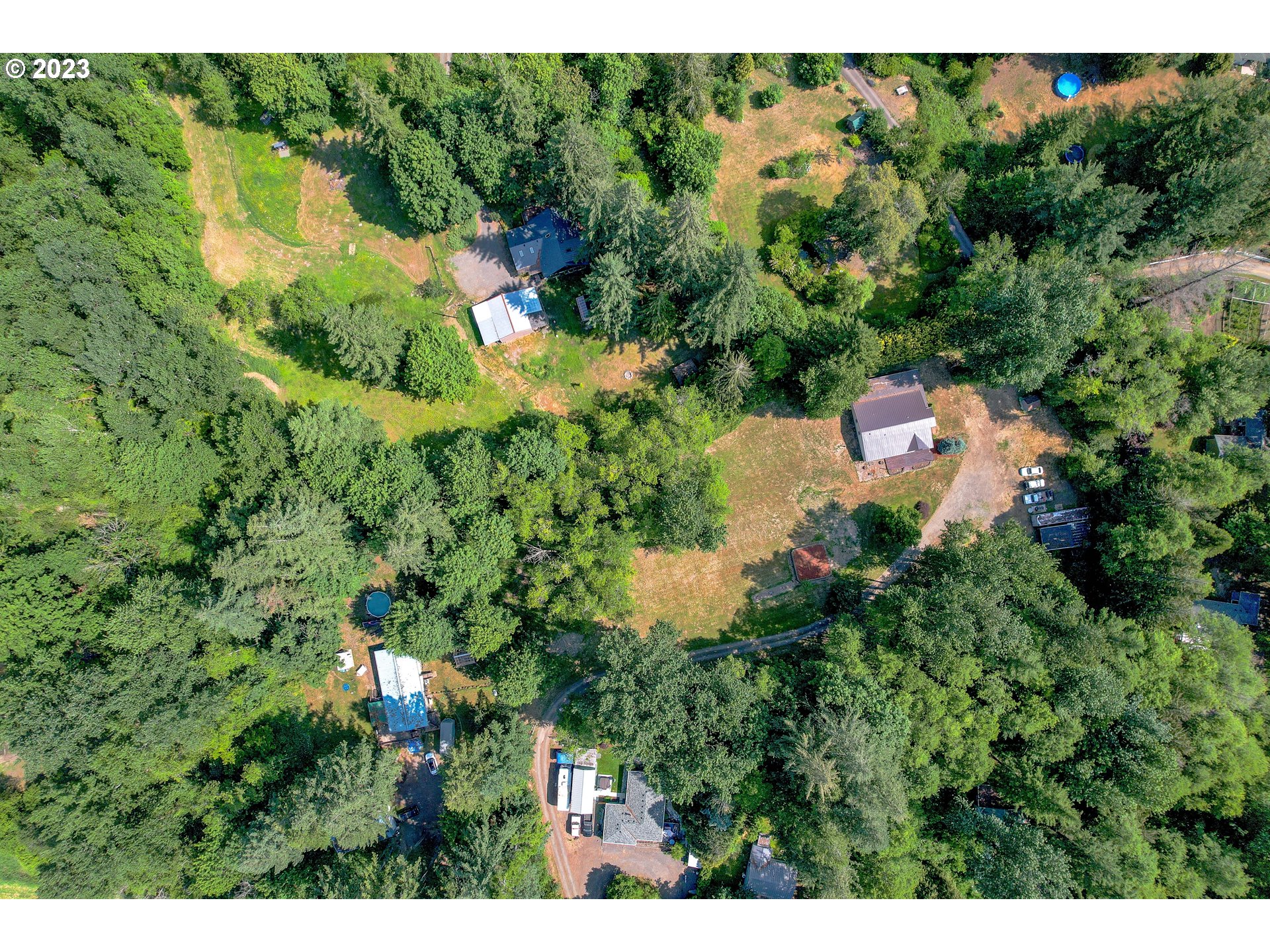 60929 Highway 26 Sandy, OR 97055 - Photo 6 of 38 a view of a house in a forest
