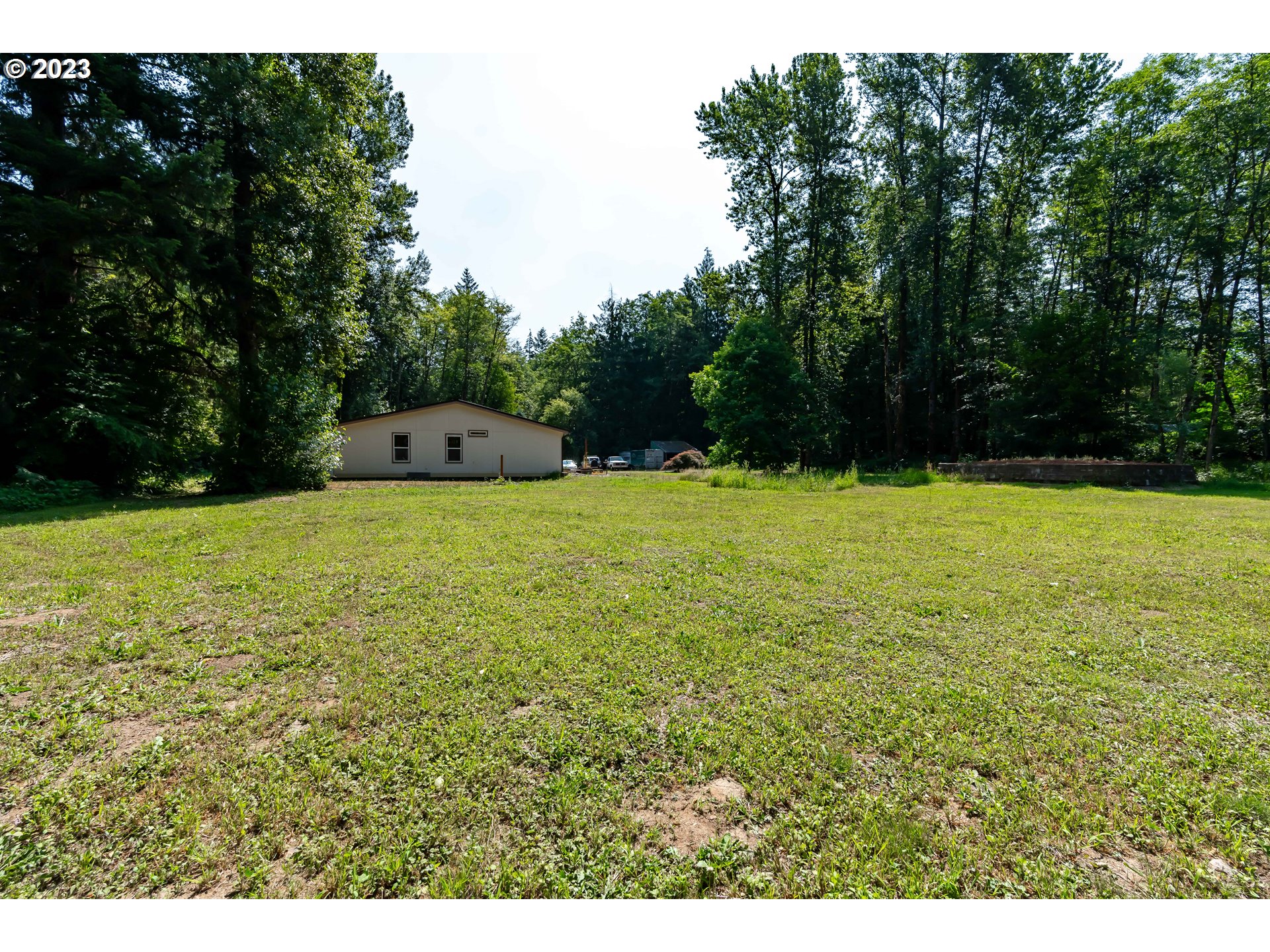 60929 Highway 26 Sandy, OR 97055 - Photo 8 of 38 a view of a swimming pool with a yard