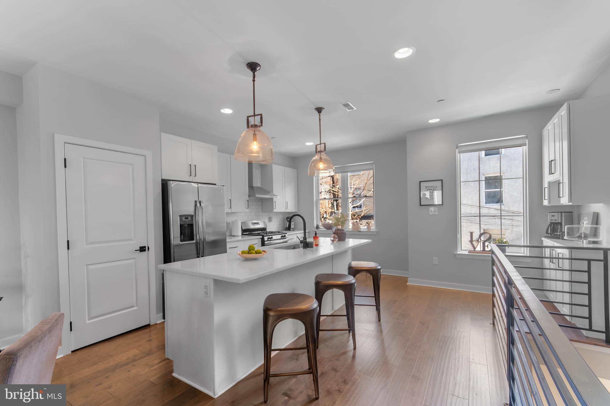 136 Burnside Street Philadelphia, PA 19127 - Photo 6 of 25 a view of a dining room and livingroom with furniture wooden floor a chandelier