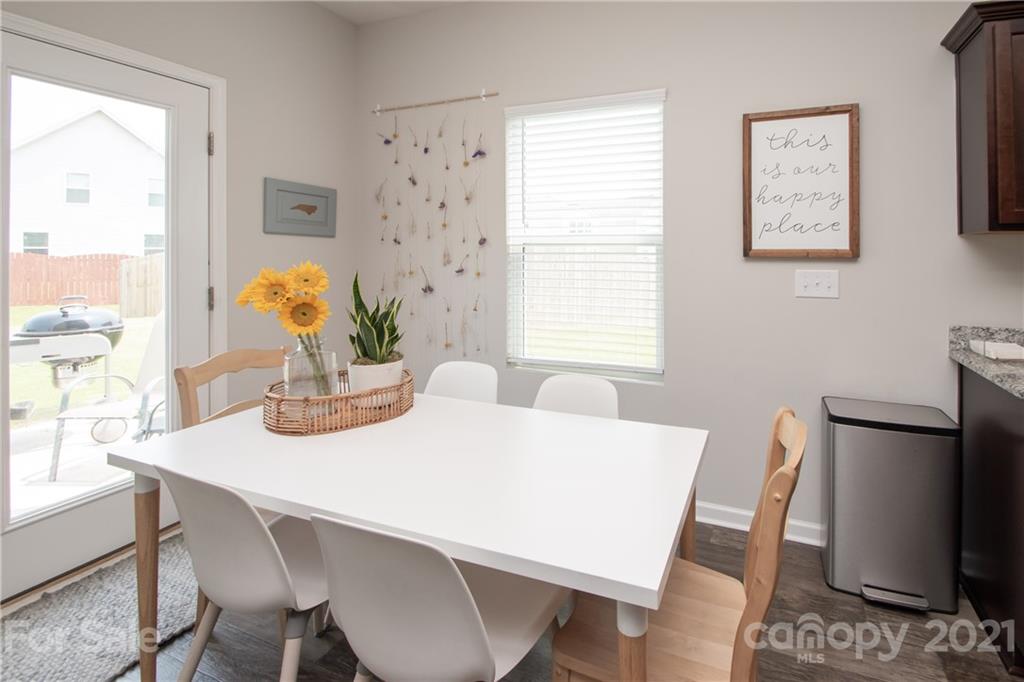 12511 Gotland Road, Unit 313 Midland, NC 28107 - Photo 15 of 31 a dining room with furniture and window