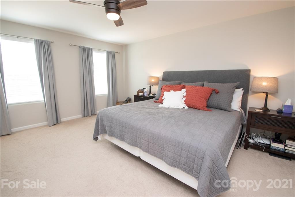 12511 Gotland Road, Unit 313 Midland, NC 28107 - Photo 18 of 31 a bedroom with a bed and a window