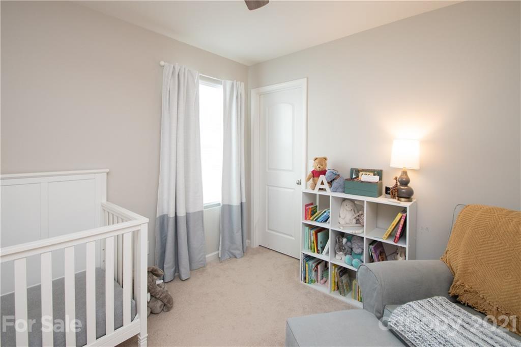 12511 Gotland Road, Unit 313 Midland, NC 28107 - Photo 26 of 31 a room with furniture and a book shelf