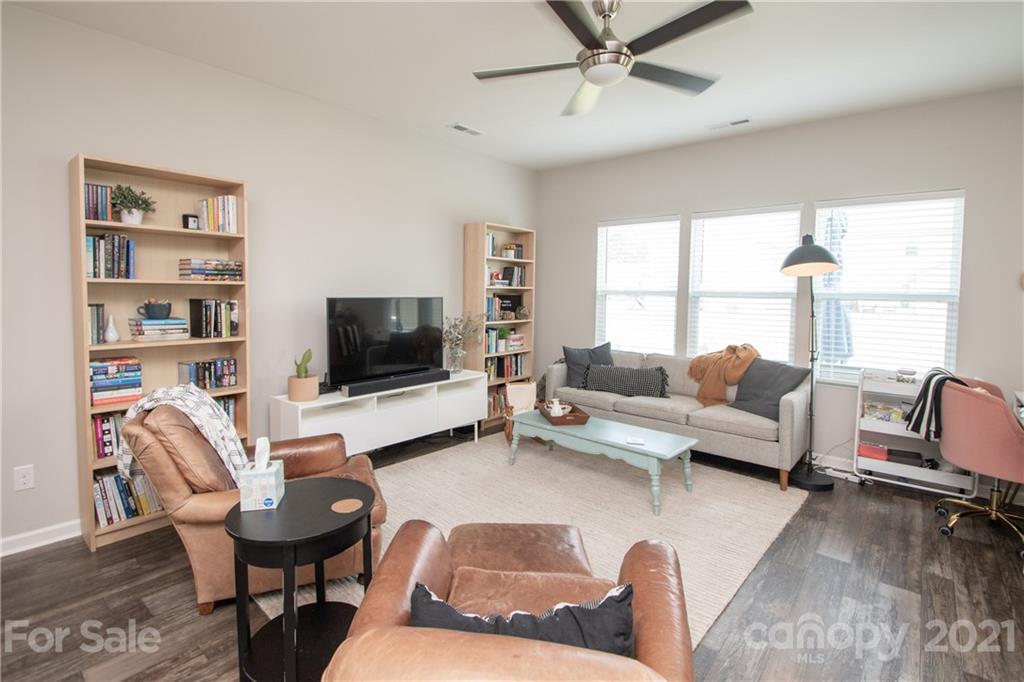 12511 Gotland Road, Unit 313 Midland, NC 28107 - Photo 6 of 31 a living room with furniture and a flat screen tv