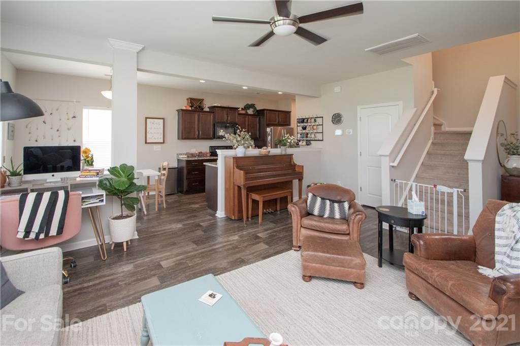 12511 Gotland Road, Unit 313 Midland, NC 28107 - Photo 7 of 31 a living room with furniture and a fireplace