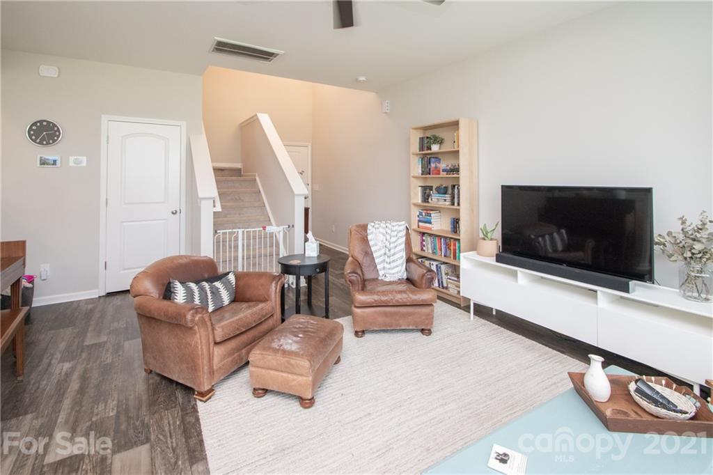 12511 Gotland Road, Unit 313 Midland, NC 28107 - Photo 8 of 31 a living room with furniture and a flat screen tv
