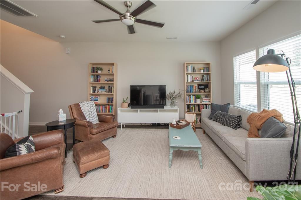 12511 Gotland Road, Unit 313 Midland, NC 28107 - Photo 9 of 31 a living room with furniture and a flat screen tv