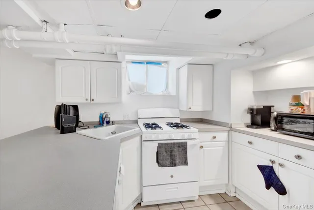 a kitchen with cabinets appliances and a counter space