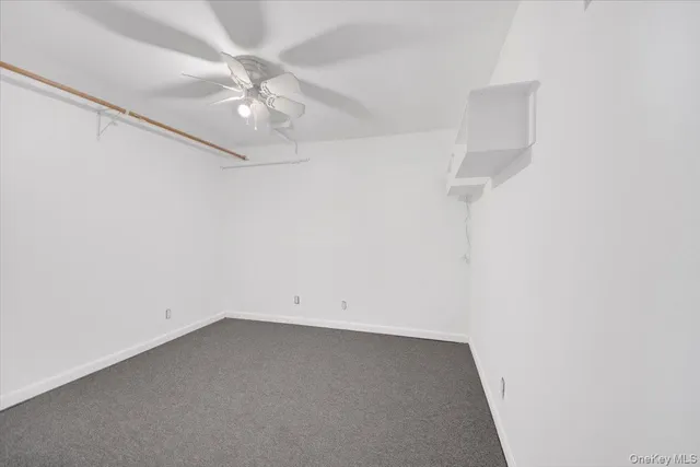 a living room with furniture and windows