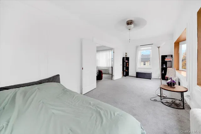 a bed room with a bed and a chair