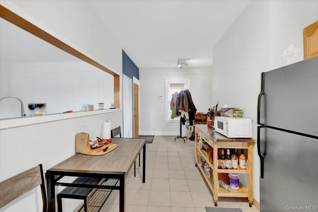 a bathroom with a sink a toilet a mirror and shower