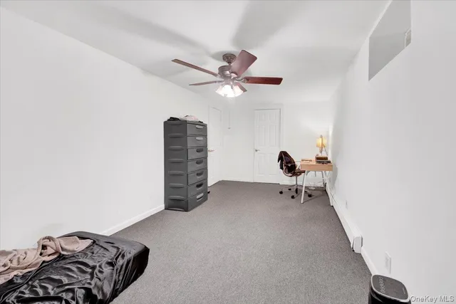 a room with a chair and a chandelier