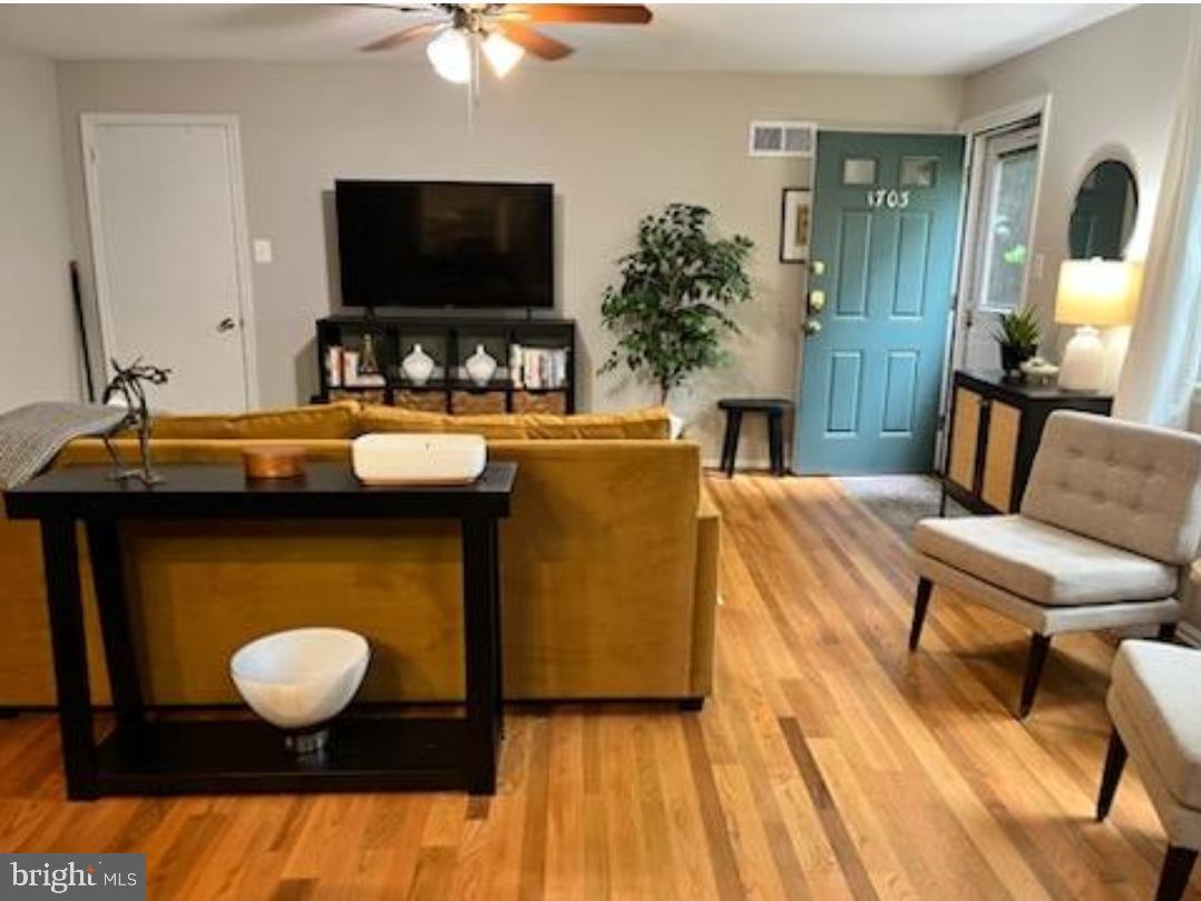 1703 Yardley Commons Yardley, PA 19067 - Photo 15 of 23 a living room with furniture and a flat screen tv